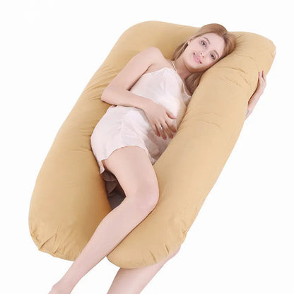 Large U-shaped pregnancy support pillow with removable cover and abdominal support belt.