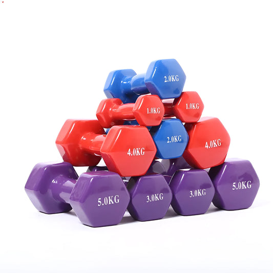 A pair of brightly coloured plastic fitness dumbbells with a glossy surface, shown on a home floor.