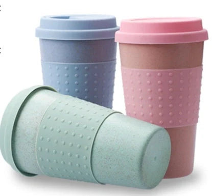 Eco-friendly wheat straw coffee cup with lid in green, pink, and blue