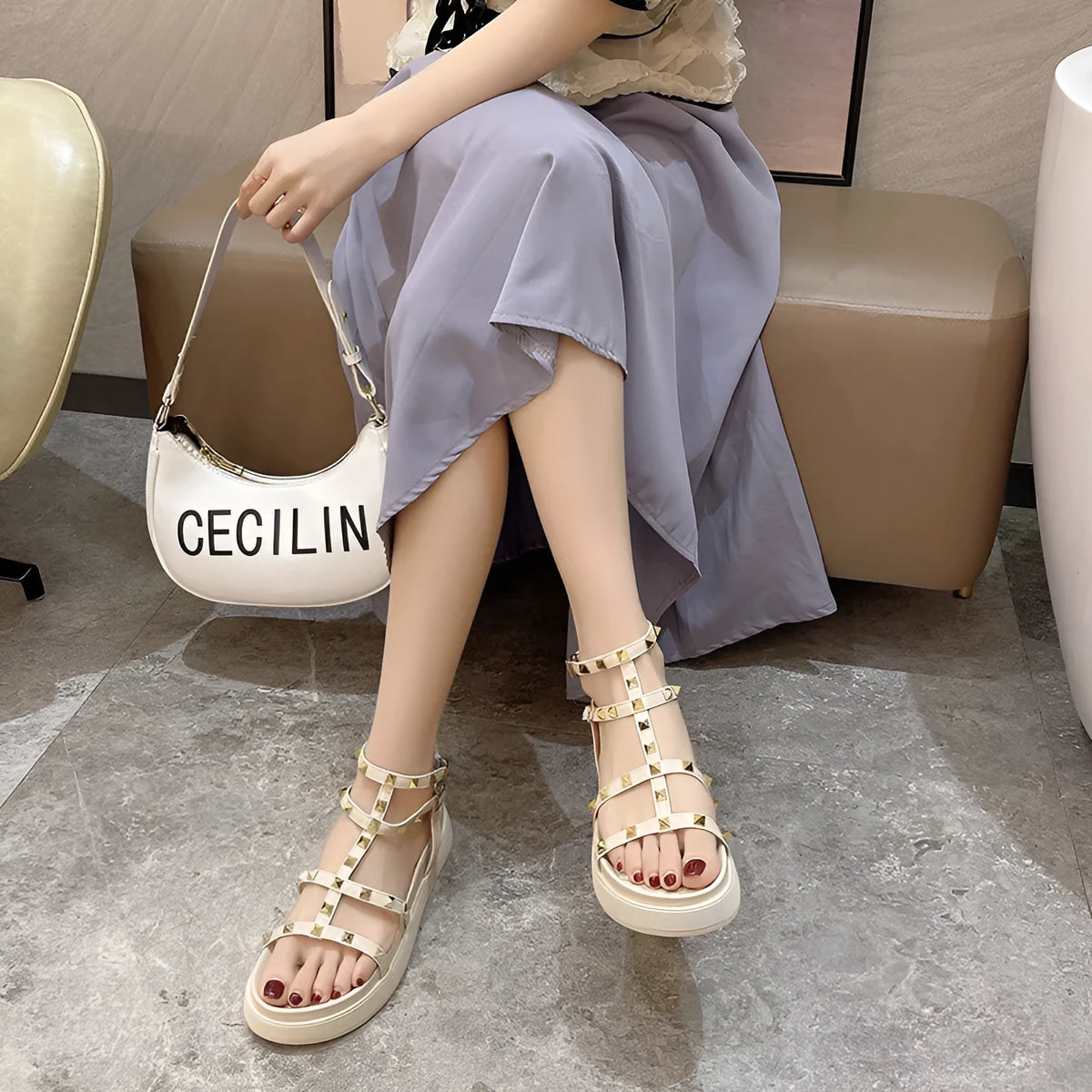 Women's Roman-style flat sandals with round toe, rivet platform, ankle buckle, PU upper, rubber sole, beige or black.