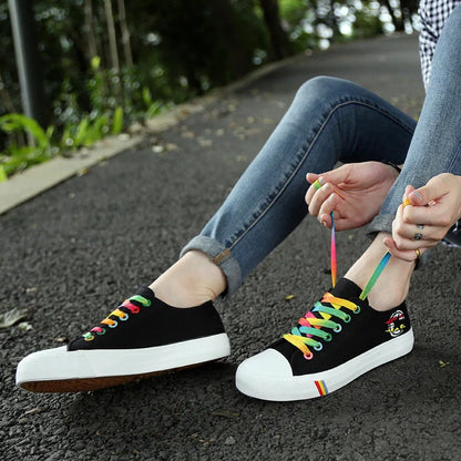 Classic canvas shoes in black and blue colours with lace-up closure and rubber sole