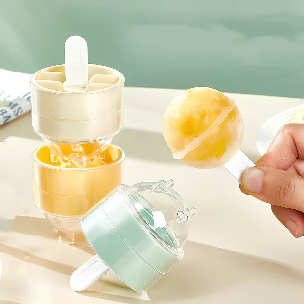 Four colourful lollipop-shaped silicone ice moulds showing creamy yellow, pink, blue, and yellow options