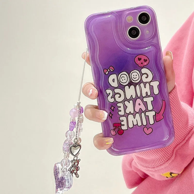 Purple graffiti design iPhone case with a silver love pendant chain attached