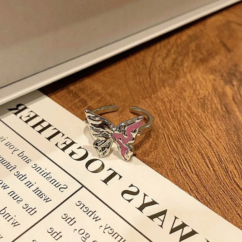 Copper women's ring with Chinese butterfly design and adjustable open loop.