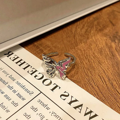 Copper women's ring with Chinese butterfly design and adjustable open loop.