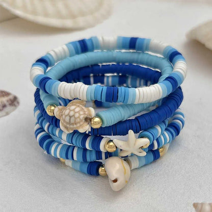 Six handmade polymer clay bracelets with geometric shell designs in bohemian blue colour