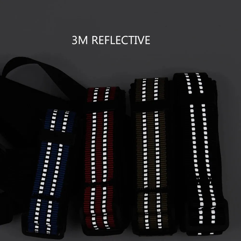 Adjustable black basket dog muzzle with reflective strips on a medium-sized dog