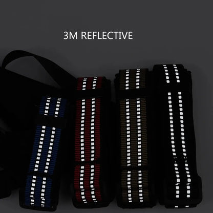 Adjustable black basket dog muzzle with reflective strips on a medium-sized dog