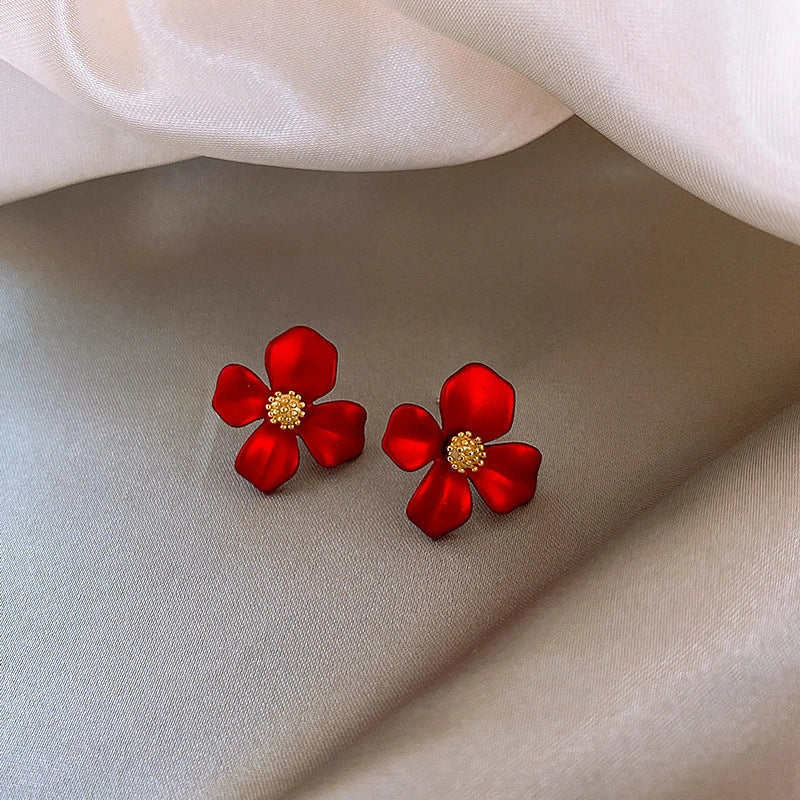 Silver-tone earrings with delicate red petal design, perfect for adding a touch of Korean-inspired elegance to any outfit.