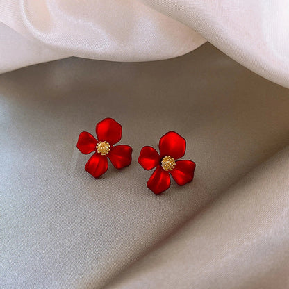 Silver-tone earrings with delicate red petal design, perfect for adding a touch of Korean-inspired elegance to any outfit.