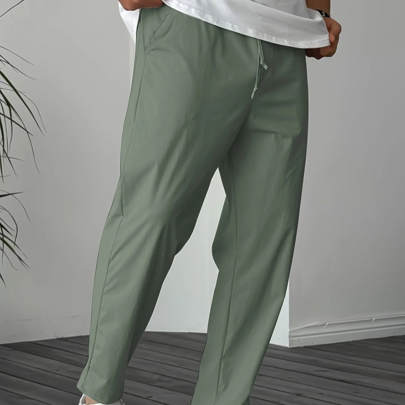 Men's khaki casual drawstring trousers with straight leg and ribbon detail on pockets