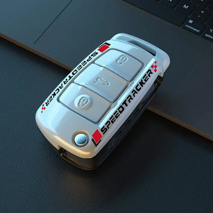 Carbon fibre style car key cover with a mirrored surface element, shown in black and white.