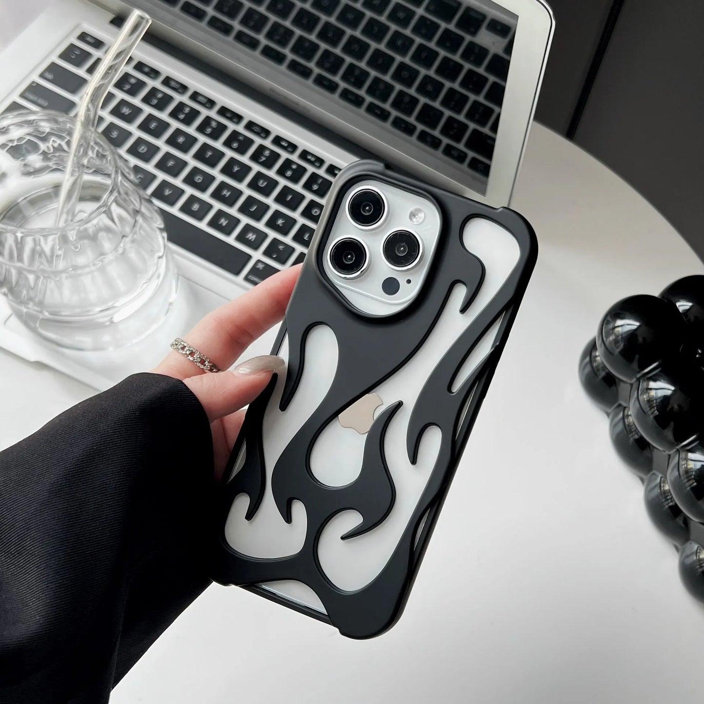 Electroplated hollow flame pattern phone case in silver plated finish on Apple iPhone, showing heat dissipation design and TPU soft shell