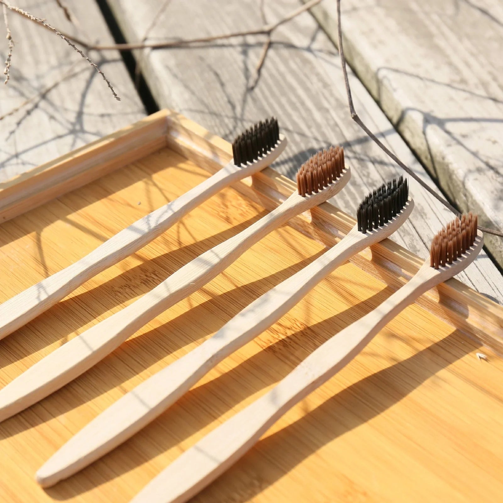 Organic bamboo toothbrush with 17.5cm ergonomic handle and charcoal-infused bristles for sustainable dental care