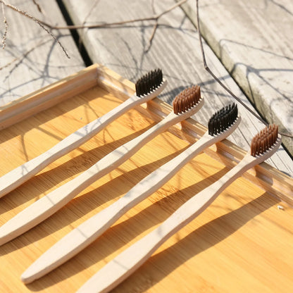 Organic bamboo toothbrush with 17.5cm ergonomic handle and charcoal-infused bristles for sustainable dental care