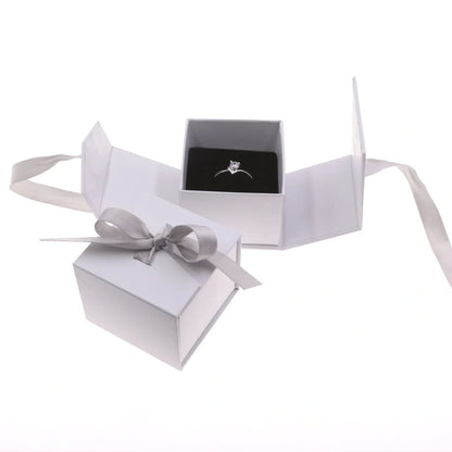 Square grey jewellery gift box with ribbon bow measuring 5x5cm for ring and earring storage