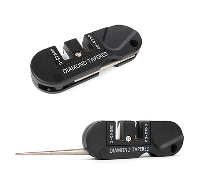Black Pocket Pal knife sharpener showing carbide blades, ceramic stones, and tapered diamond rod on 3.5-inch compact unit