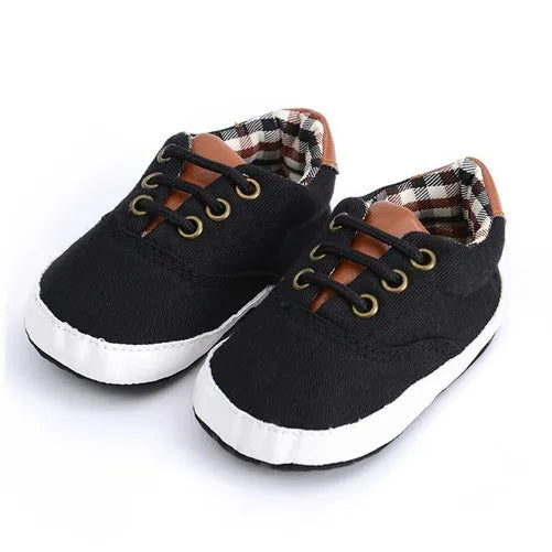 Baby canvas shoes in solid colour with soft bottom and front strap, sizes 11cm to 13cm