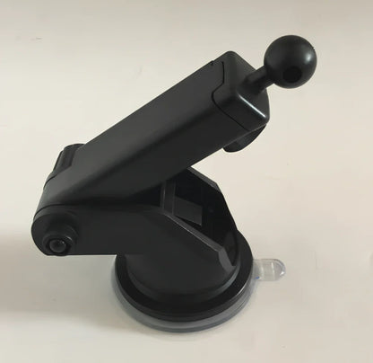 Black car wireless charger phone holder with suction cup mount and 360-degree rotation on a dashboard