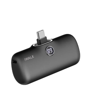 Compact lipstick-style power bank showing screen display with battery percentage, measuring 78mm x 51mm x 25mm
