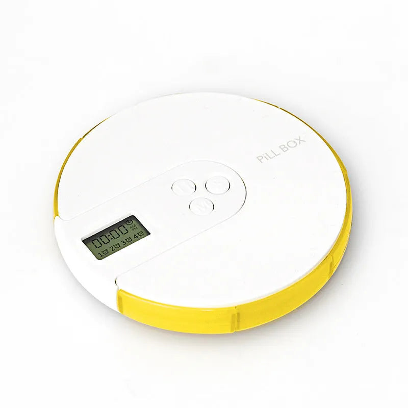7-compartment alarm clock pill dispenser showing medication organisation with timer display