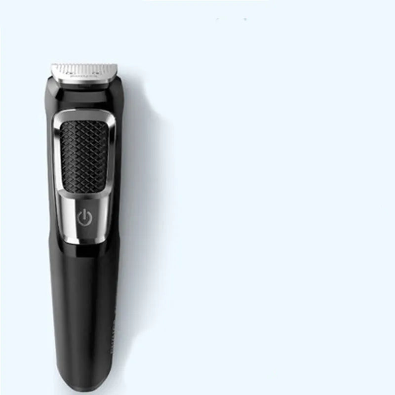 Men's nose hair and beard trimmer with cleaning brush and charging cable on a white background.