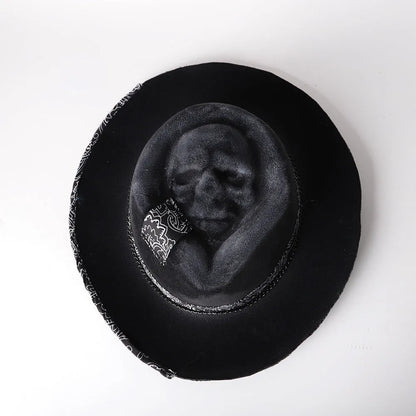 Handmade wool felt skull hat with conical crown design, showing textured surface and distinctive silhouette