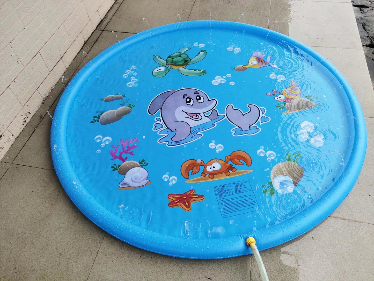 Blue PVC children's water spray play mat with marine animal designs for outdoor garden use