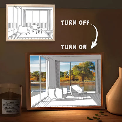 LED illuminated decorative picture light on a table showing a scenic landscape image glowing from within.