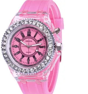 Women's LED luminous quartz watch with silicone strap and round alloy case on wrist
