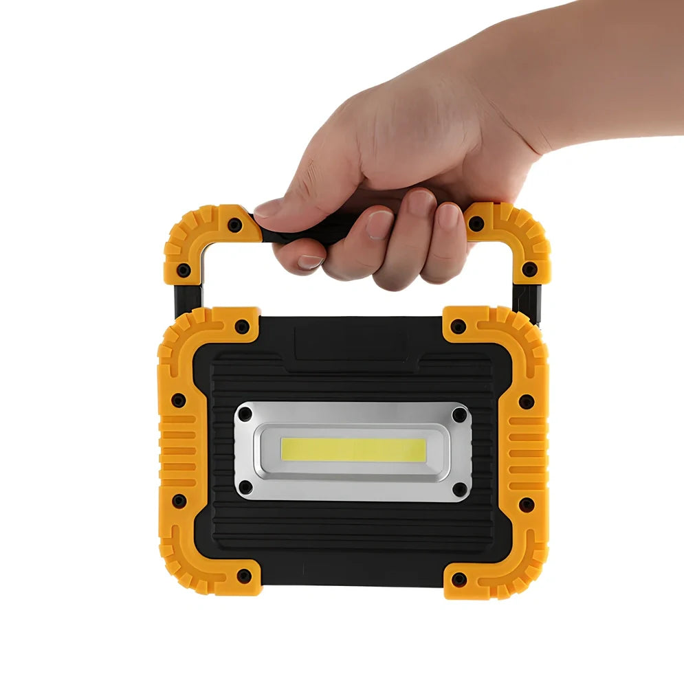 LED camping lantern with rotatable support showing USB ports and battery indicator lights