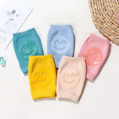Cozy knee pads in various colors designed to protect babies during crawling with a non-slip, stretchy fit