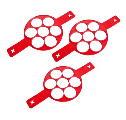 Red silicone egg mould measuring 3x3x6 inches for creating shaped hard-boiled eggs without shells