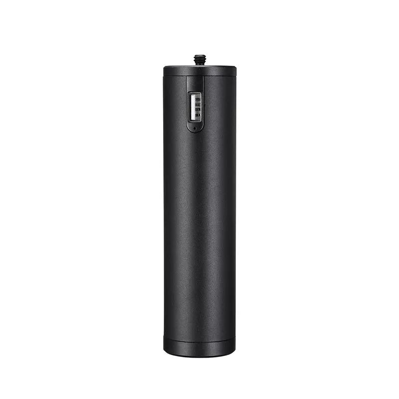 Black aluminium alloy portable power bank with an integrated carry handle, shown next to a smartphone for scale.