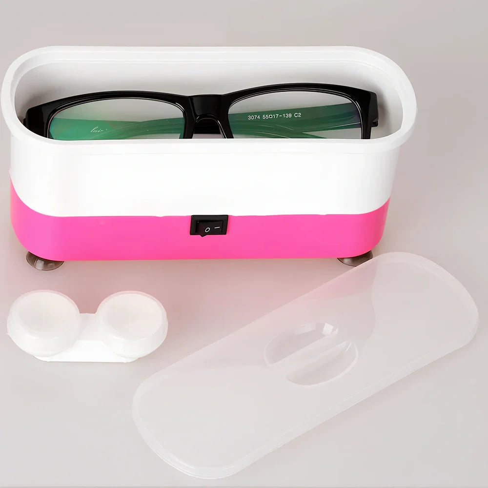 Blue analog ultrasonic cleaner measuring 17x6x8cm with contact lens box and battery compartment