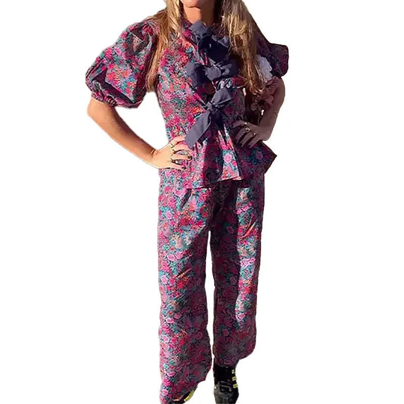 Floral print trousers suit with puff sleeves and tie-neck top in picture colour