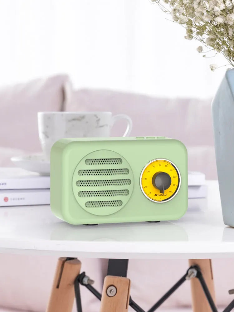 Portable Bluetooth wireless speaker with FM radio in wood grain finish