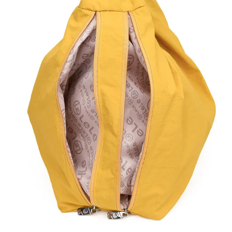 Heart-shaped soft nylon underarm shoulder bag for women in black, blue, khaki, or yellow.