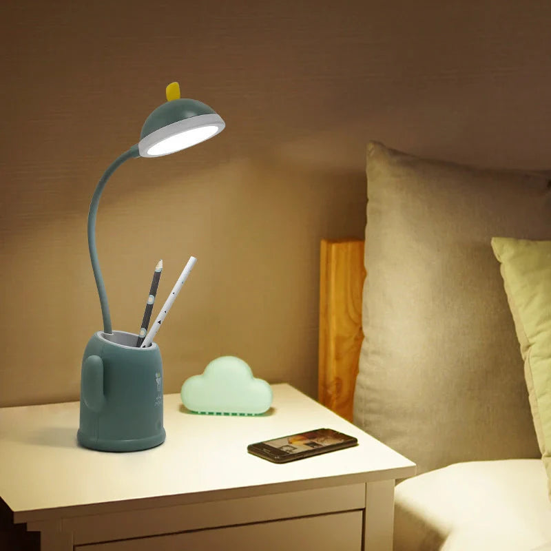 Cactus-shaped table lamp with pen holder and USB cable, available in green, pink, and grey