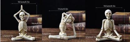 Spooky skeleton desktop decorations featuring intricate resin skulls and skeletons in vintage white and ominous black color options