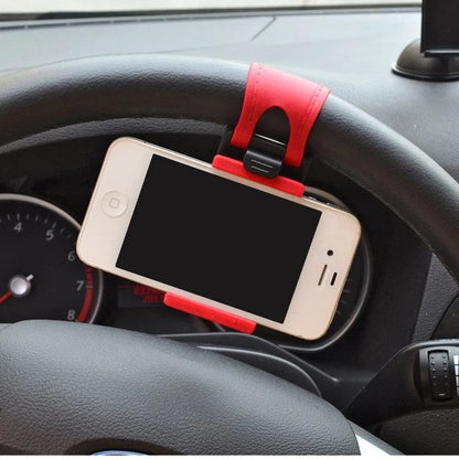 Black steering wheel phone holder with 75mm clip mounted on car wheel holding smartphone