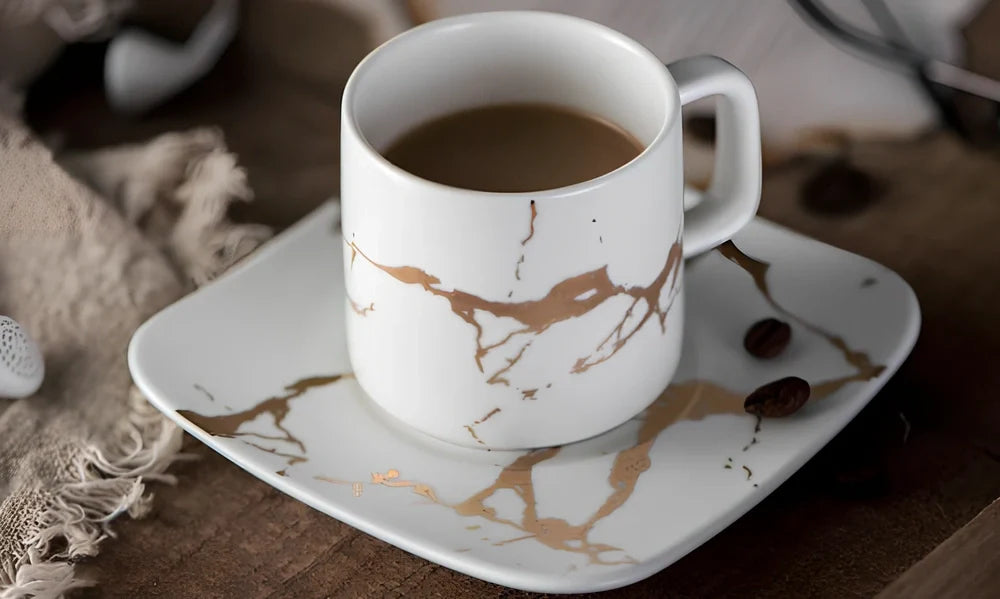 White ceramic coffee mug with double-wall construction showing cross-section insulation detail