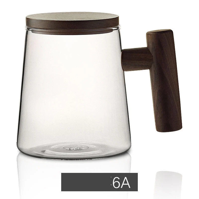 Premium glass tea infuser cup with wooden handle, offering a unique tea-water separation system and temperature-resistant construction for a refined tea experience.