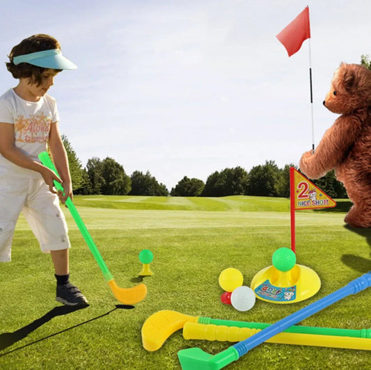 Children's golf set with three clubs, three balls, putting hole with flag, and adjustable tees on green surface