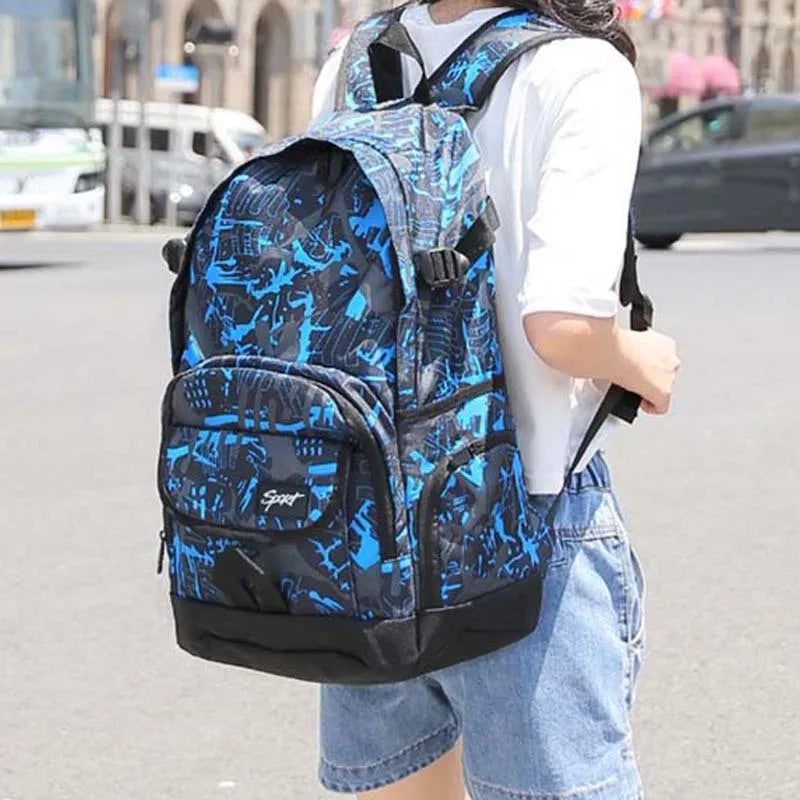Blue classic nylon backpack with multiple compartments and adjustable straps, shown with laptop sleeve