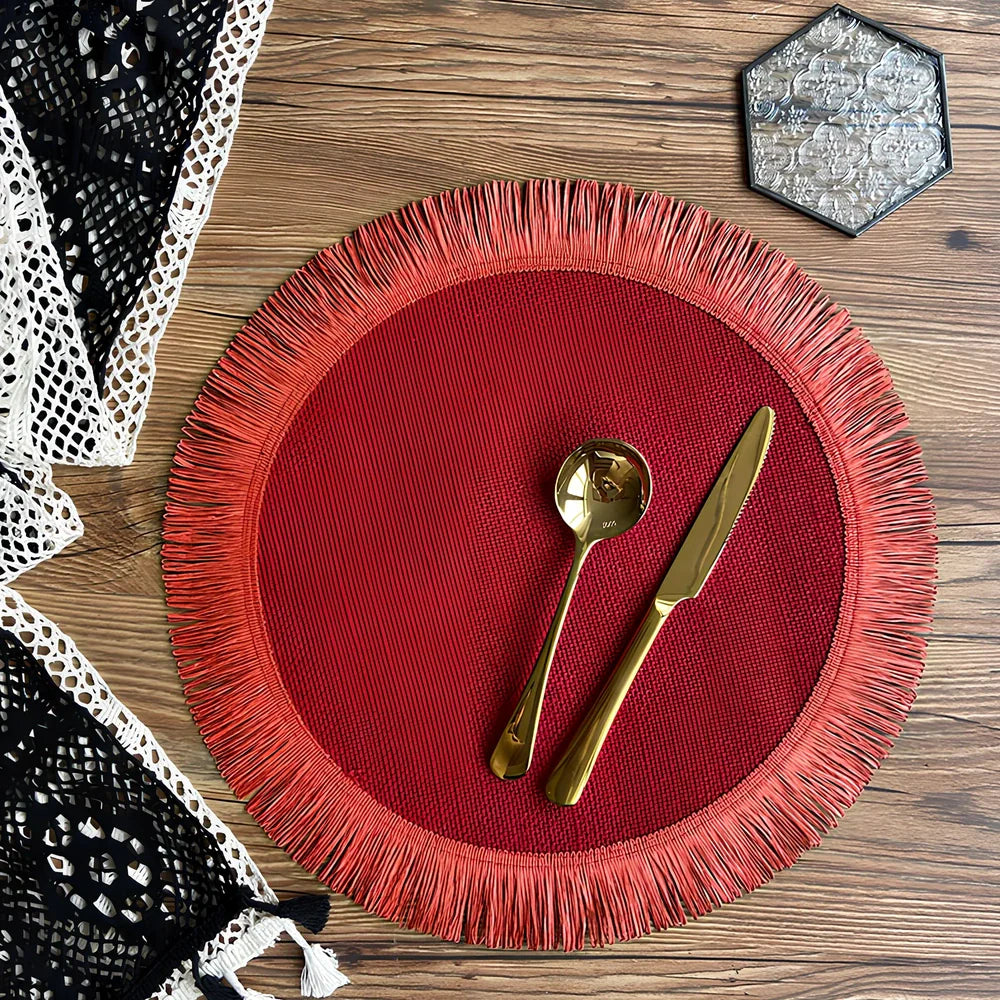 Round handwoven jute placemat with decorative tassels measuring 30cm diameter in Christmas green colour