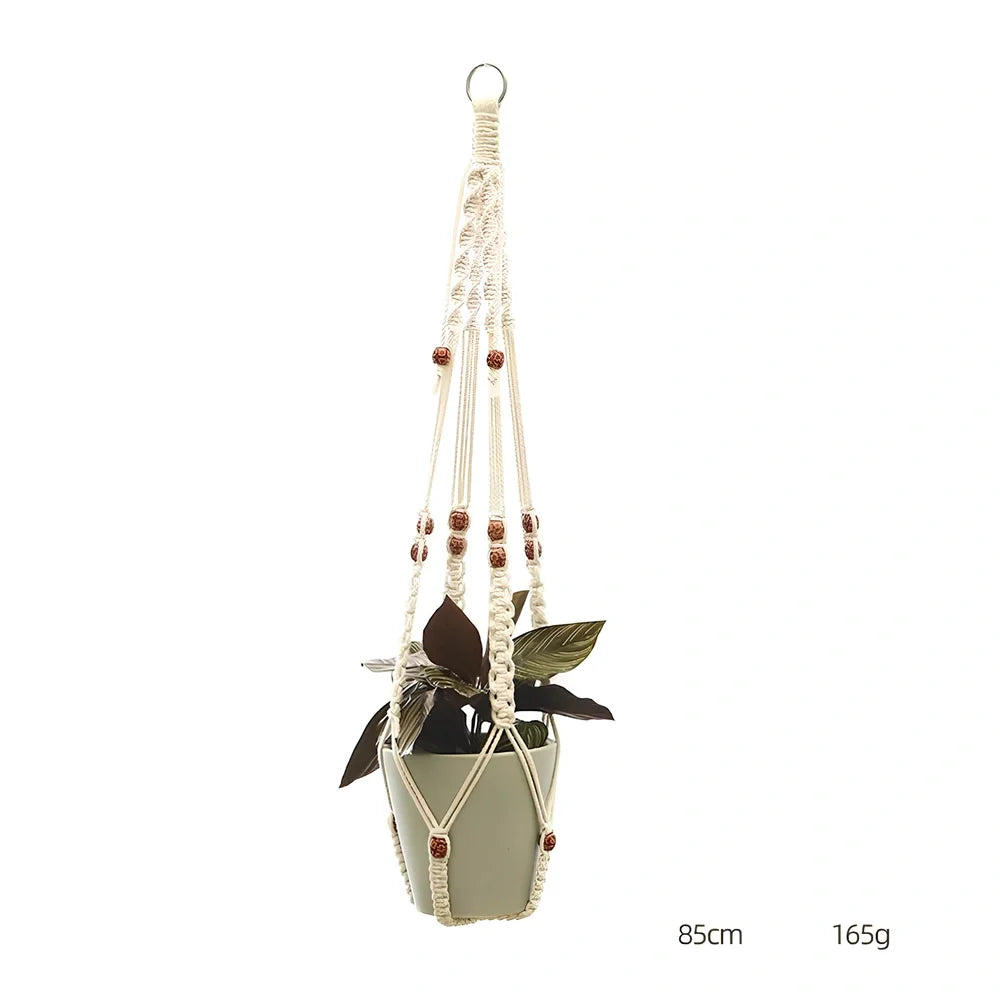 Hand-knitted cotton flowerpot net bag showing mesh pattern and hanging installation