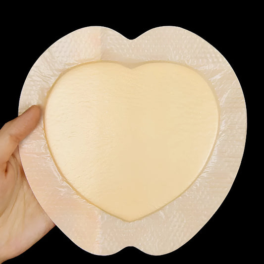 Skin-coloured silicone gel foam bedsore dressing on white background