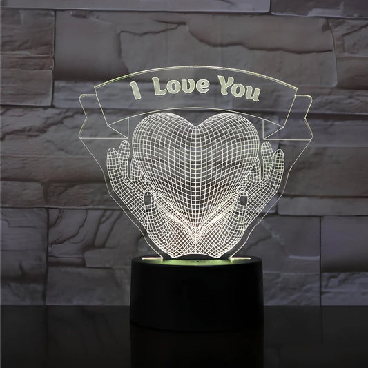3D acrylic night light with hands holding heart design, showing seven colour options and remote control