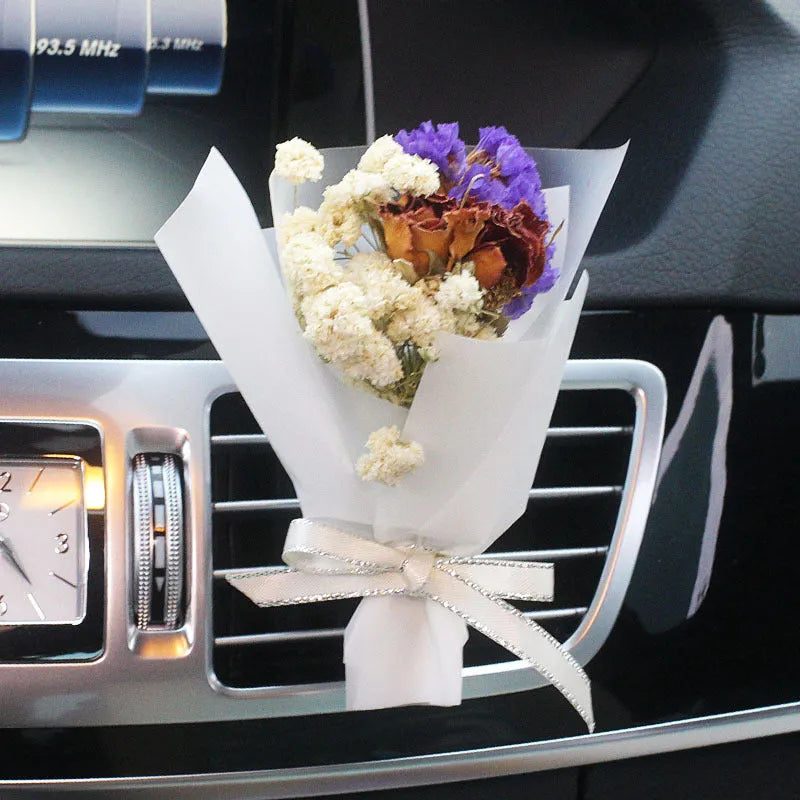 Mini dried flower bouquet mounted in car air vent for decorative aromatherapy